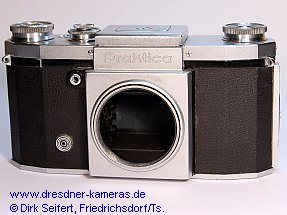 Praktica, nachger�stete Blitzsynchronisation 1 DIN-Buchse (Praktica, Versionen mit angegossenen Trage�sen und mit eingeschraubten Trage�sen) Importeur: Kine Camera Co. a Division of Ocean Photo Supply Co. Inc., 11 West 20th Street, New York 11, N.Y.